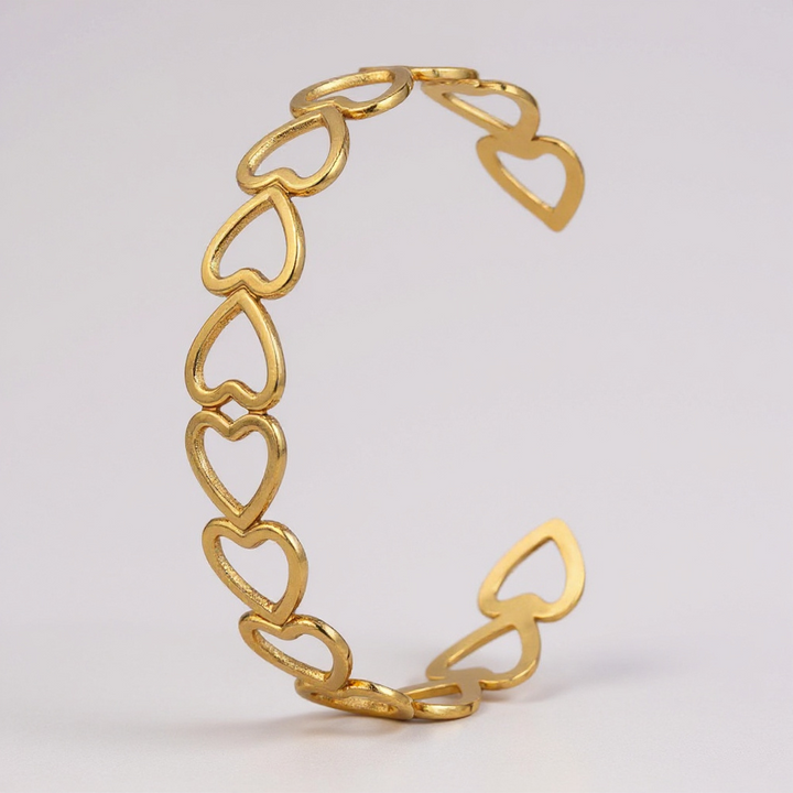 Pulsera de eslabones de corazón abierto dorado