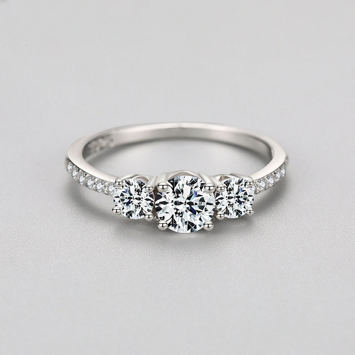 Triple Radiance: Sterling Silver Ring with Trio of Crystal Accents