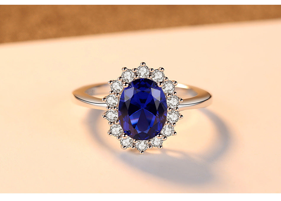 Sterling Silver Ring with Blue Sapphire Crystal and Halo Design