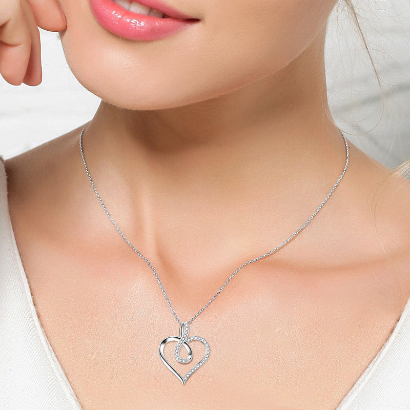 Collar con colgante de corazón e infinito en plata de ley