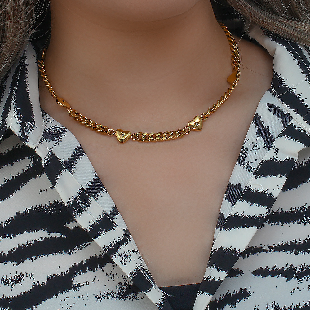 Golden Charm Chain Necklace with Heart Motifs