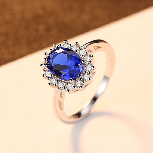 Sterling Silver Ring with Blue Sapphire Crystal and Halo Design