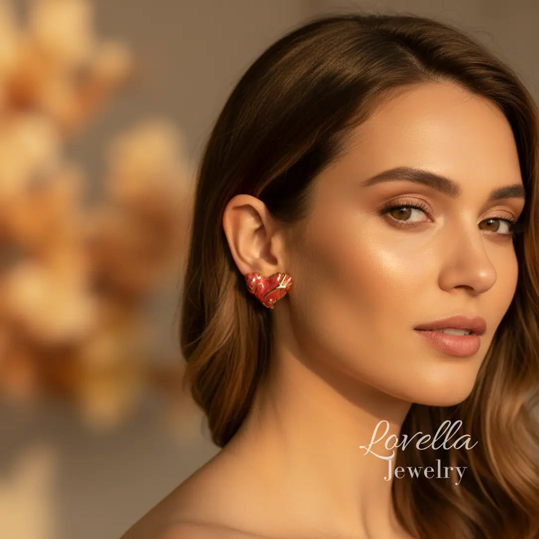 Woman wearing a floral earring with a blurred background and 'Lovella Jewelry' branding.