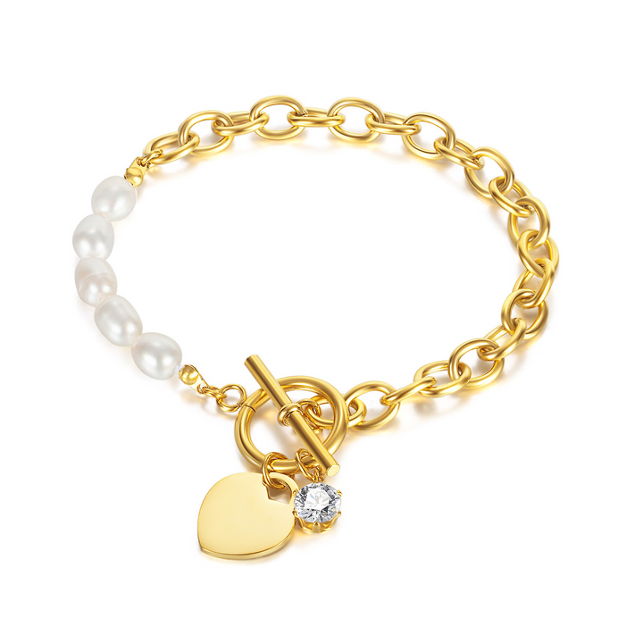 Elegante pulsera con dije de corazón de oro y perlas