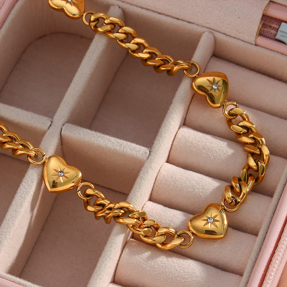 Golden Charm Chain Necklace with Heart Motifs