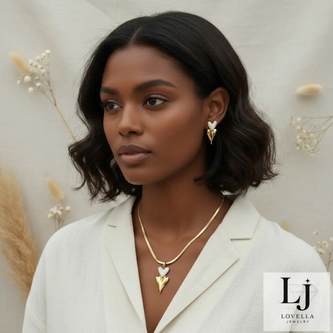 Woman wearing gold jewelry with a neutral background and Lovella Jewelry logo.