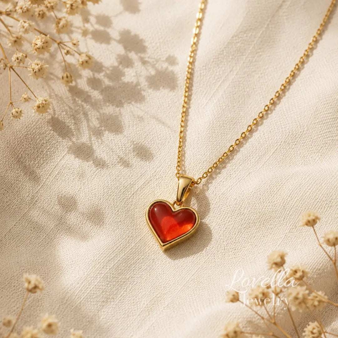 Amore Red Heart Necklace laid flat showing gold-plated chain, pendant, clasp and extender