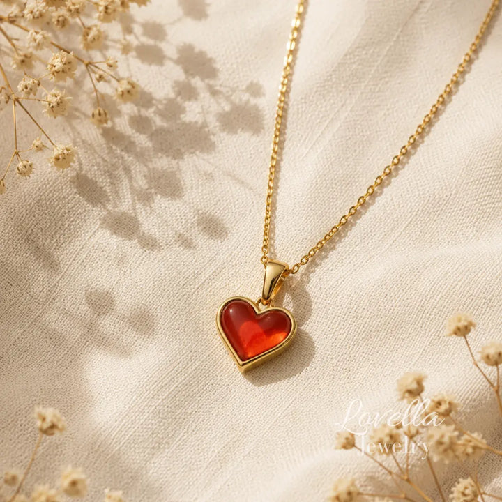 Amore Red Heart Necklace laid flat showing gold-plated chain, pendant, clasp and extender