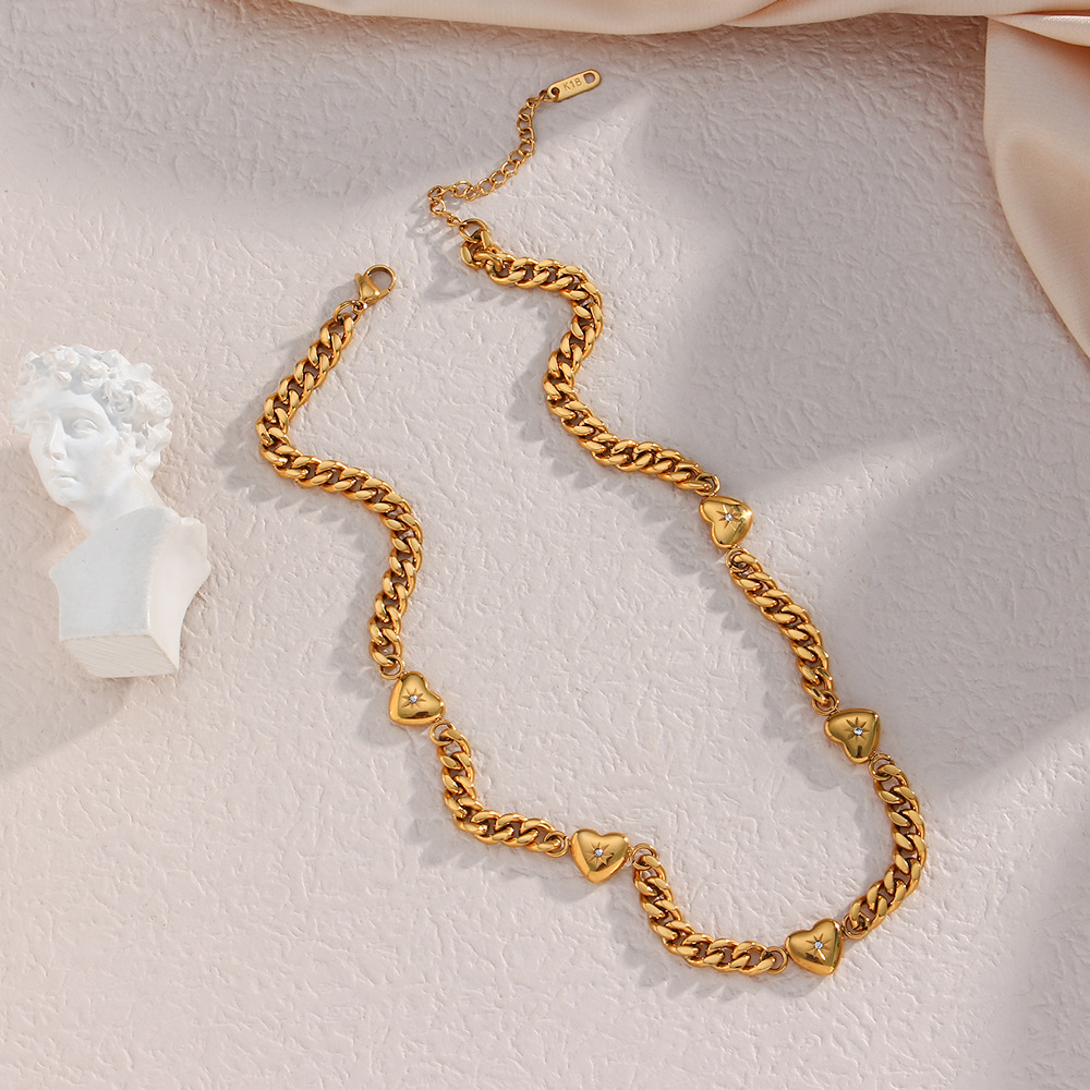 Golden Charm Chain Necklace with Heart Motifs