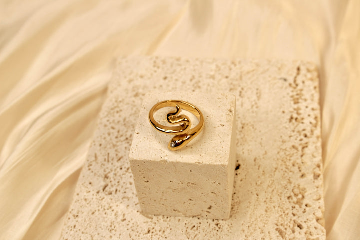 Golden Serpentine Ring with Crystal Accents