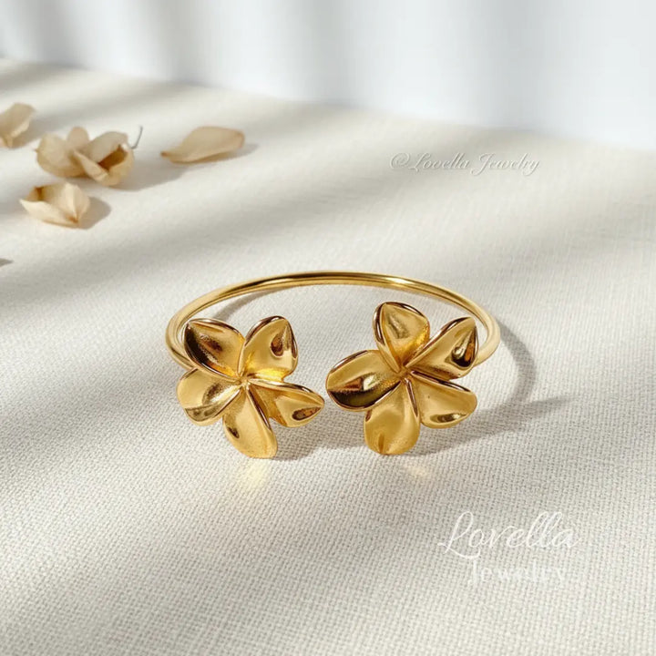 Pulsera de puño abierta con doble flor en oro