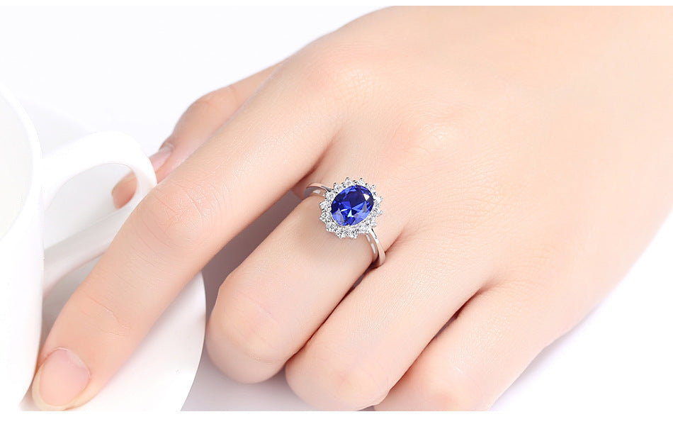 Sterling Silver Ring with Blue Sapphire Crystal and Halo Design