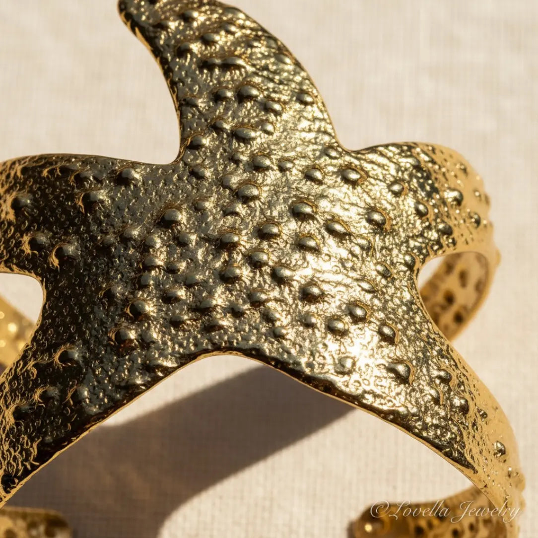 Gold textured ring on a beige background
