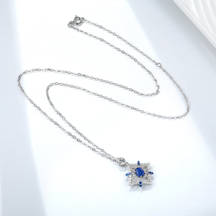 Ice Queen Elegance: Blue Sapphire Snowflake Necklace with Crystal Embellishments