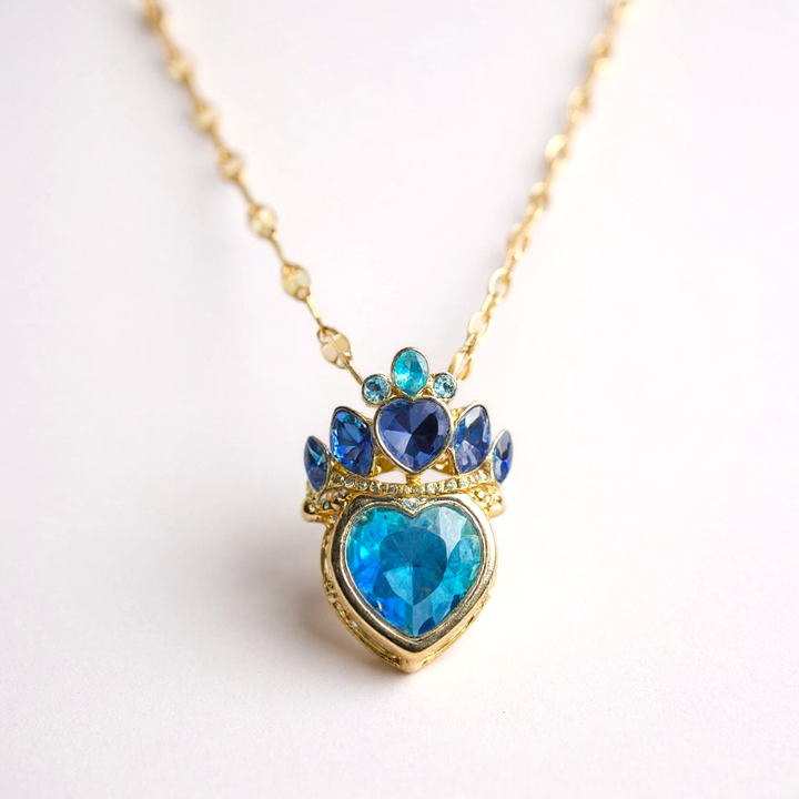 Collar con corona de piedras preciosas azules: acero inoxidable en tono dorado