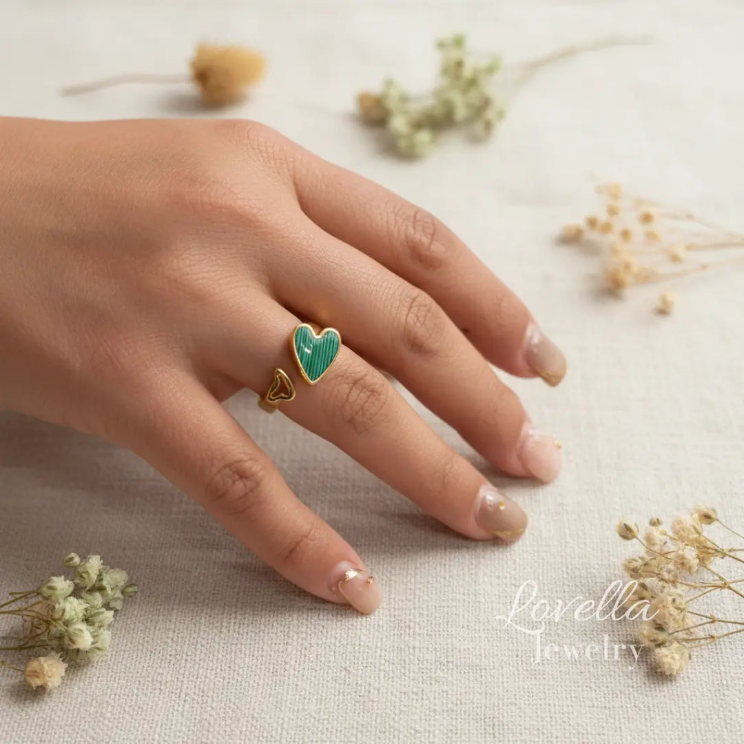 Striped heart enamel ring on hand, adjustable gold band  
Gold adjustable ring with emerald green striped heart enamel