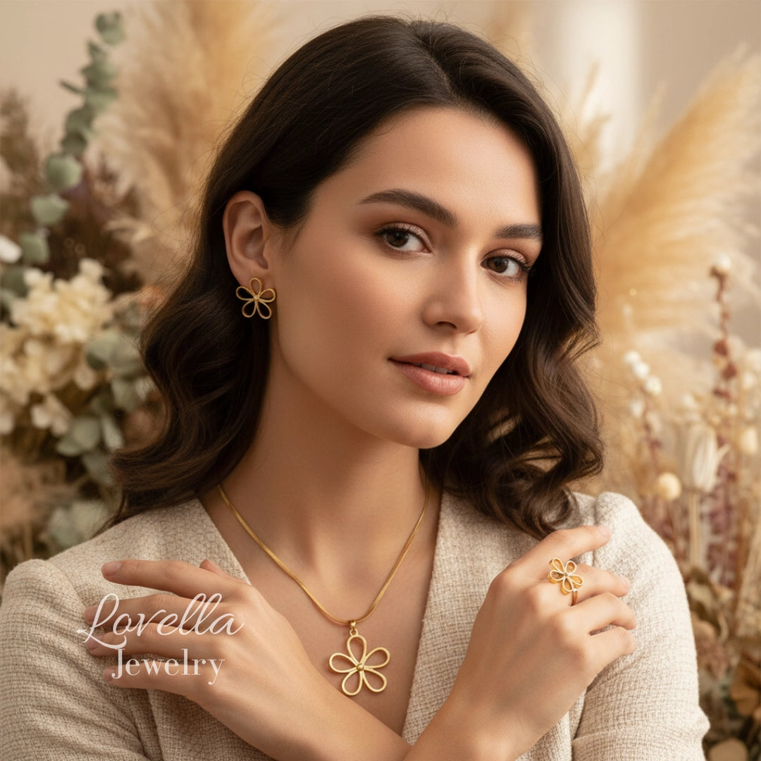 Woman wearing gold jewelry with a soft, blurred background