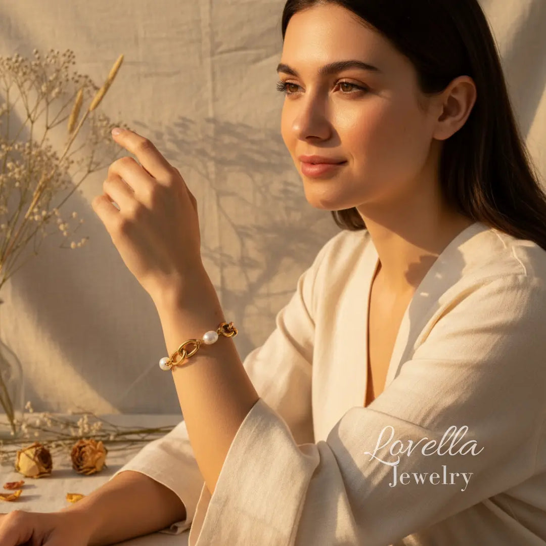 Woman wearing a pearl bracelet with a scenic background, featuring Lovella Jewelry.