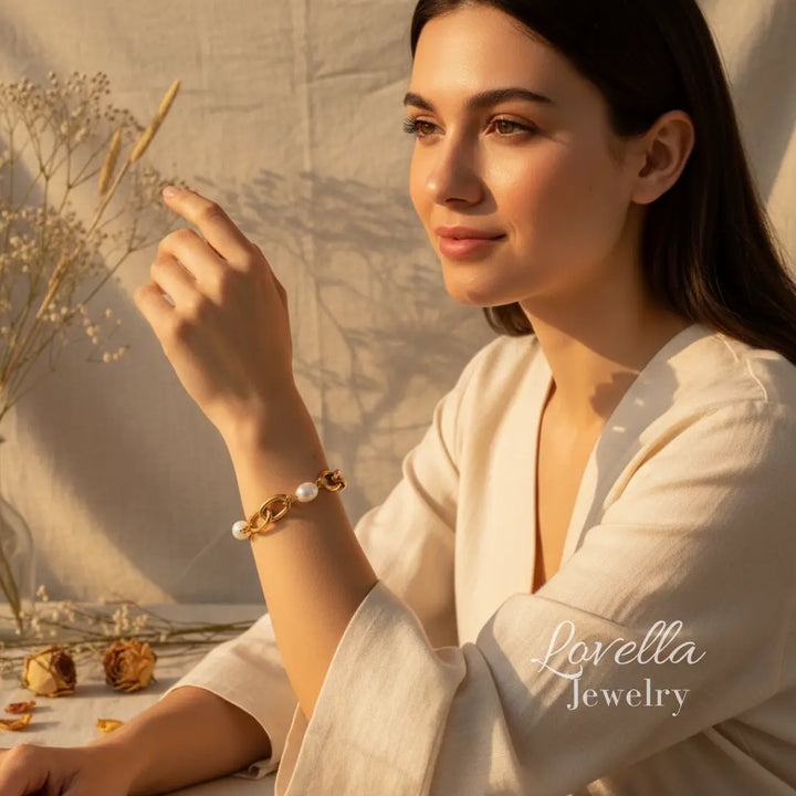 Woman wearing a pearl bracelet with a scenic background, featuring Lovella Jewelry.