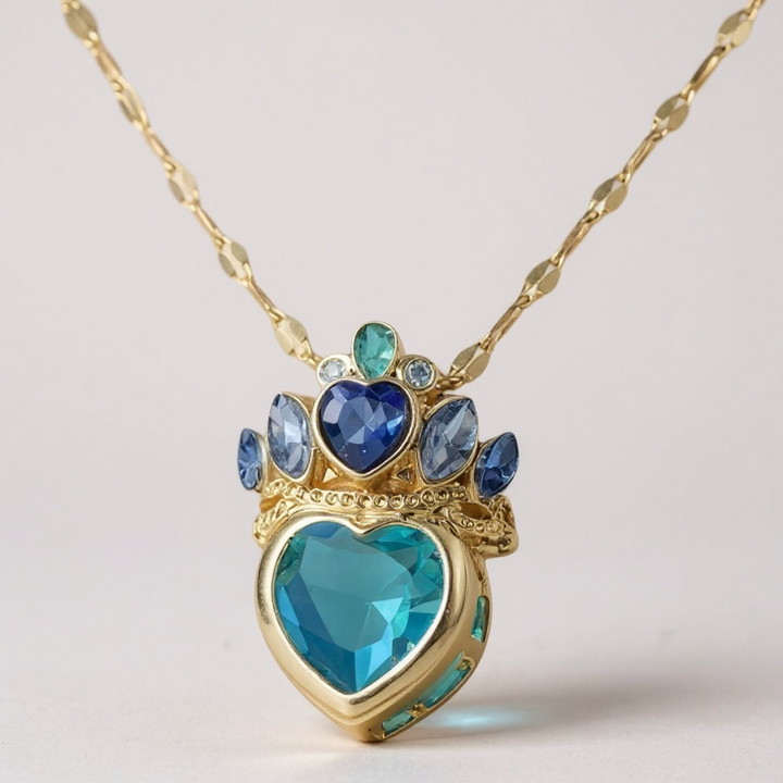 Collar con corona de piedras preciosas azules: acero inoxidable en tono dorado