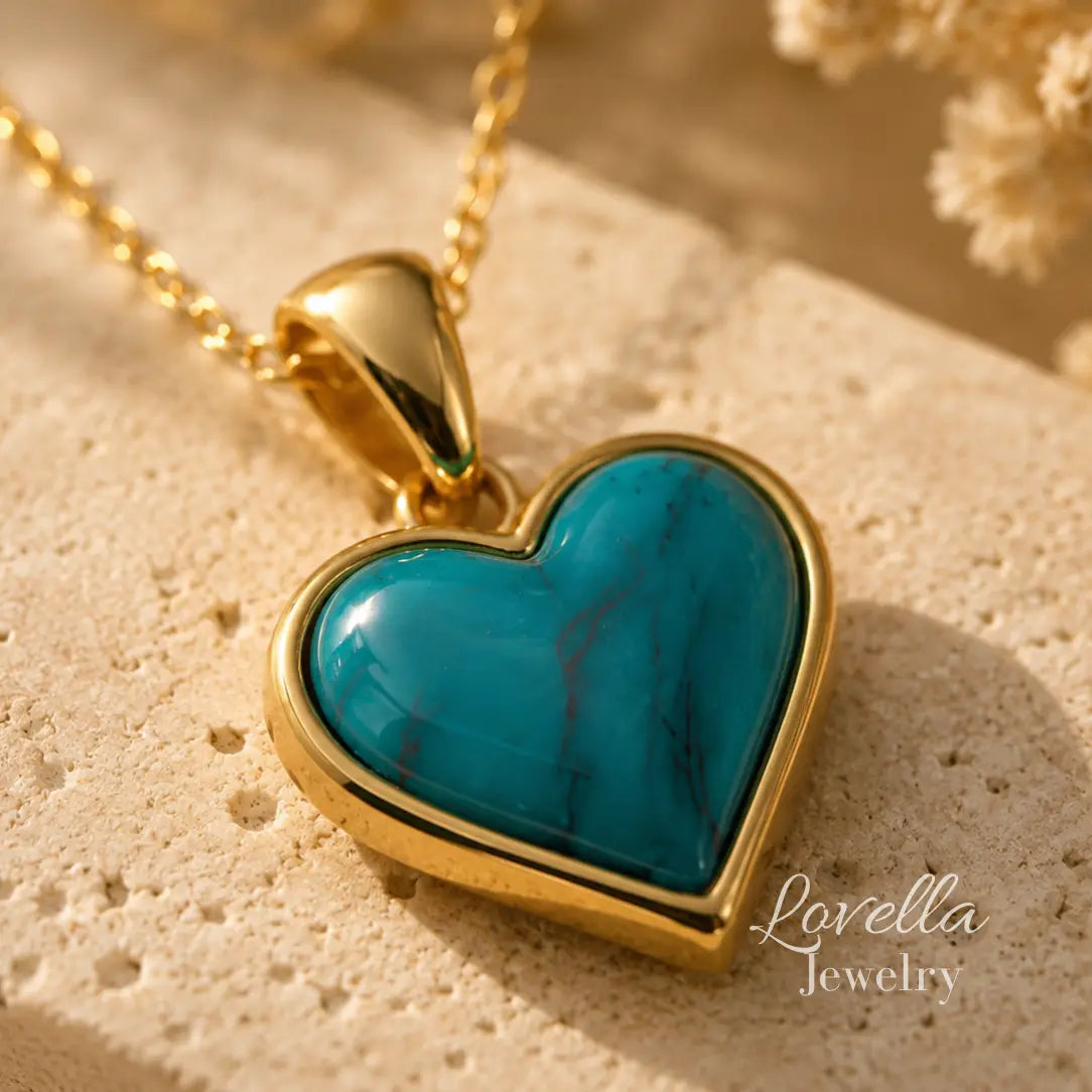 Close-up of Amore Heart Necklace showing glossy turquoise heart centerpiece and gold-tone frame