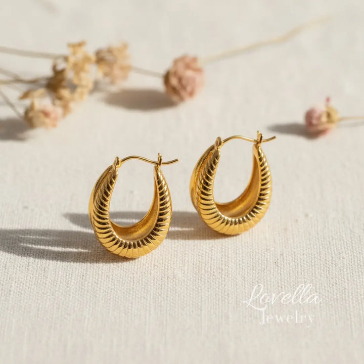 Gold hoop earrings on a light background with 'Lavella Jewelry' branding.