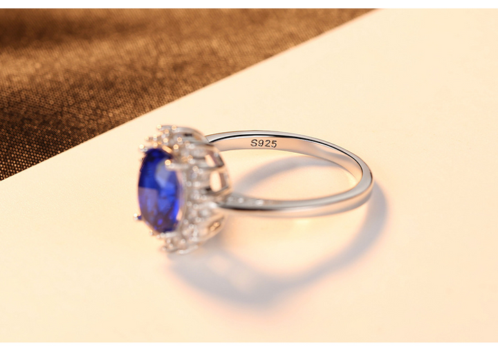 Sterling Silver Ring with Blue Sapphire Crystal and Halo Design