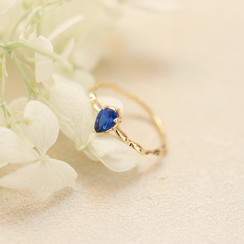 Twisted Gold Band Ring with Sapphire Crystal