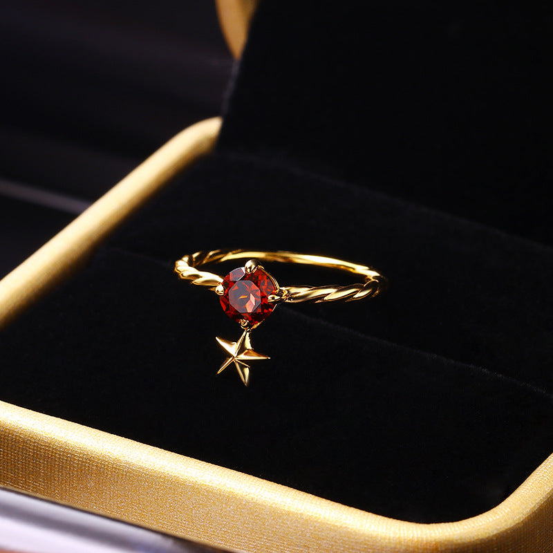 Anillo de plata con estrella de cinco puntas y piedra de circón cúbico rojo